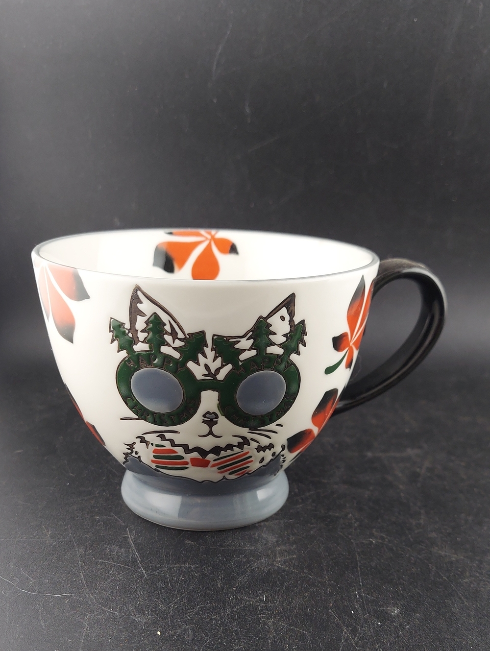 White Ceramic Cat Art Mug with Green Sunglasses and Orange Floral Accents